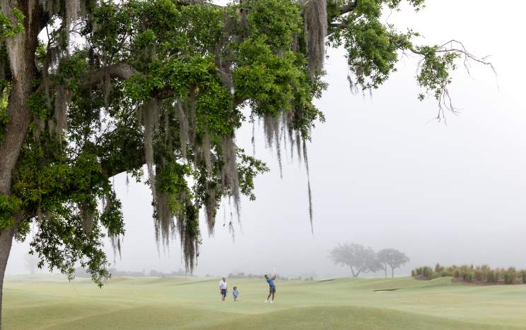 Family on Links golf course during morning at Evermore Orlando Resort