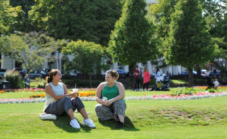 Ladies sat in Imperial Gardens in Cheltenham