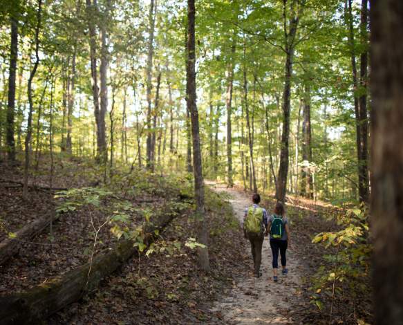 Two people hiking at Monroe Lake