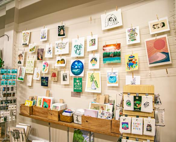 Display of wall art and prints at Gather Handmade Shoppe