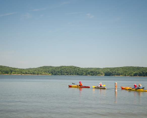 Four people kayaking on Monroe Lake