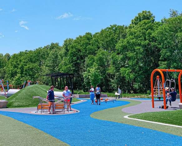 People playing at the Switchyard Park playground