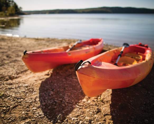 Kayaks on the shore of Monroe Lake