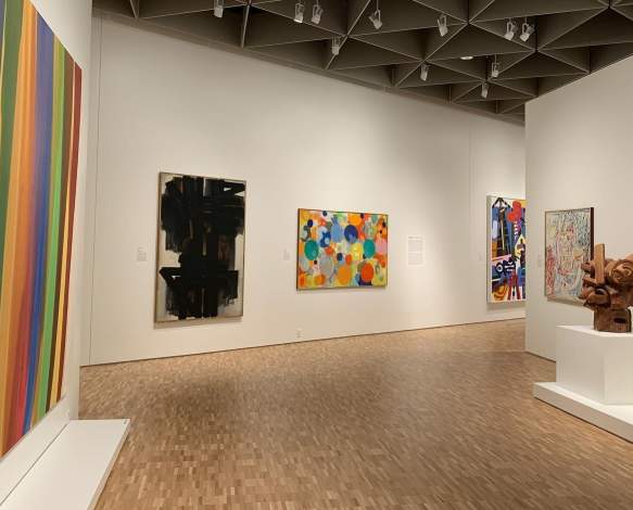 A few pieces of artwork in a gallery at the Eskenazi Museum of Art