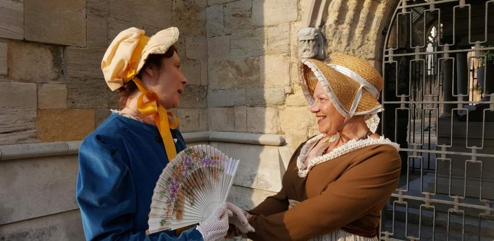 Two women dressed up as Jane Austen