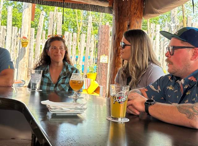 Friends drinking a beer at Sconni's