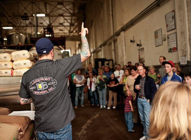 tour guide talking while crowd listens intently