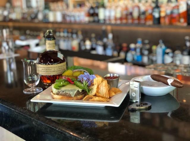 Burger with drink and cigar