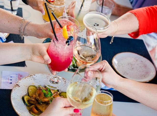 Group Cheers at Table.