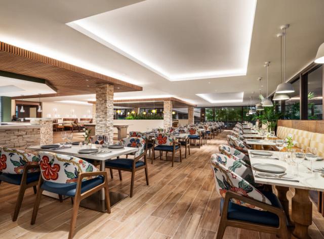 Interior Dining Area: Floral Chairs, Stone Tables