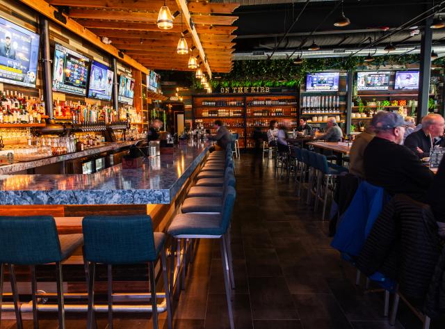 Bar Seating with TVs and Liquor Wall