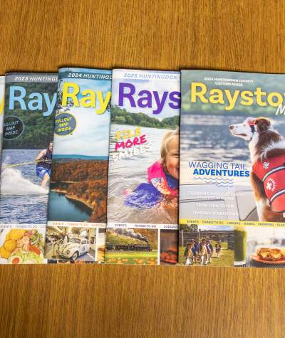 Huntingdon County Visitors Guides in a line 2022-2026