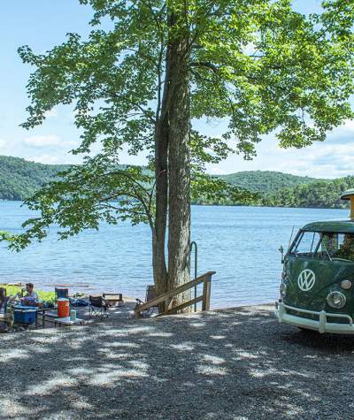 Vintage camper van in a campsite along the shore of Raystown Lake