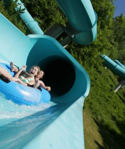 Young children on a water slide at Lake Raystown Resort's Wild River Waterpark
