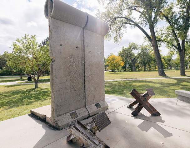 pieces of the berlin wall and tank traps that are found in memorial park in rapid city south dakota