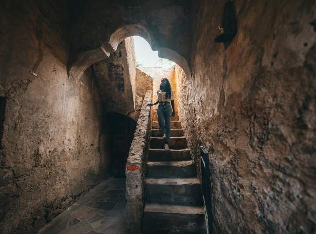 Woman walking down stairs at San Antonio Missions National Historical Park