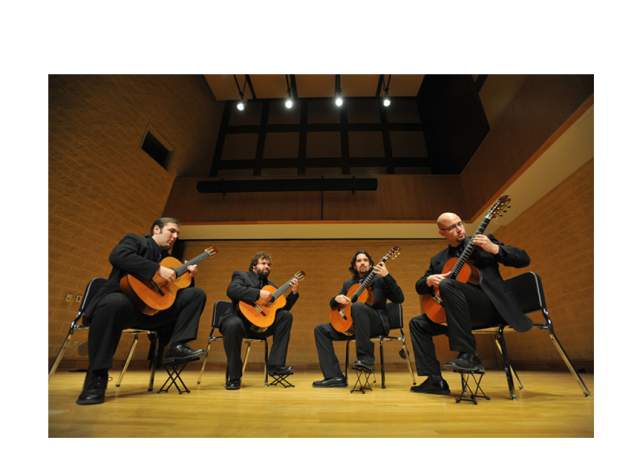 group of guitarists performing