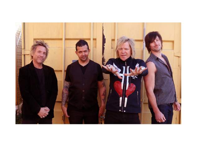 Slippery When Wet posing for a photo for their Ultimate Bon Jovi Tribute at Clyde's Theatre.