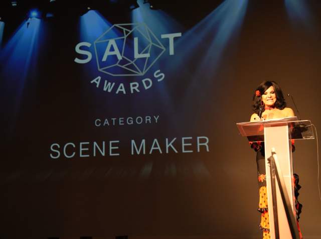 Person at podium with screen behind them says Salt Awards