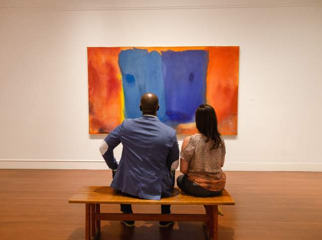 Visitors contemplate a painting on display at the RISD Museum in Providence Rhode Island