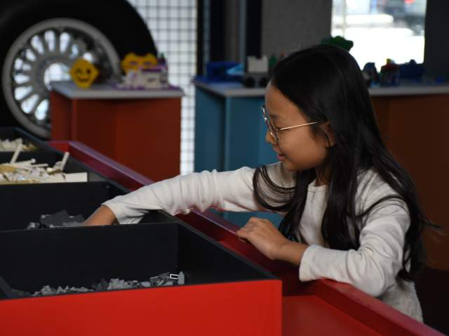 A child playing with legos at the leonardo