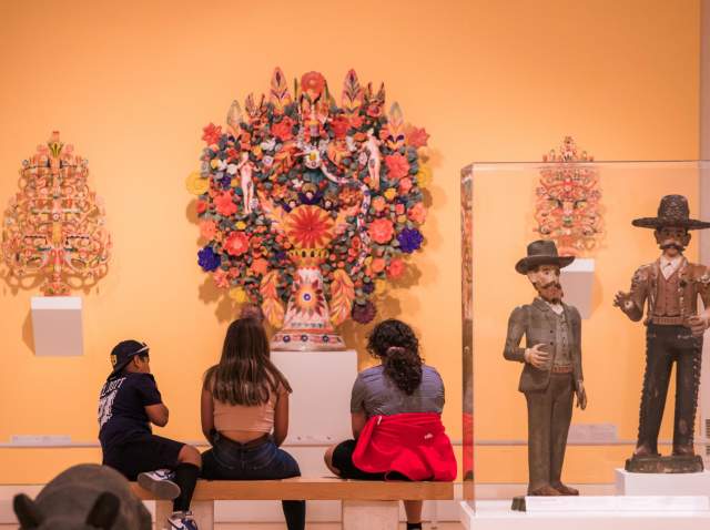family at latino american art exhibit at San Antonio Museum of Art