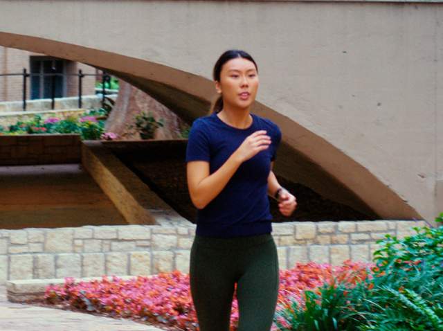 Girl running at the San Antonio River Walk