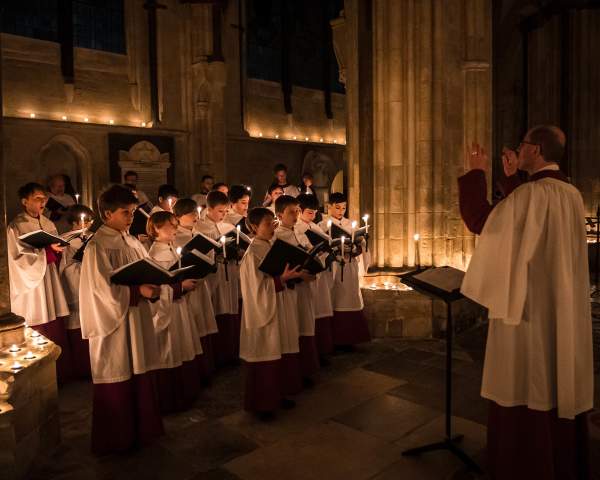 a choir of children singing in Chichester Cathedral