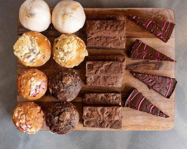 cakes and sweet treats on a board