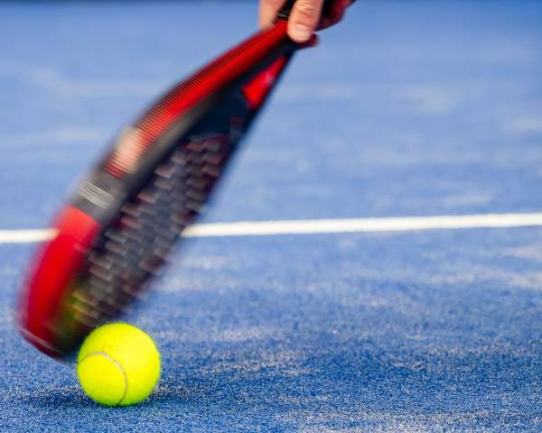 A padel racket and ball
