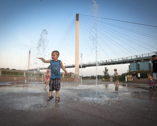 Children Playing in Splash Area at Base of Bob the Bridge