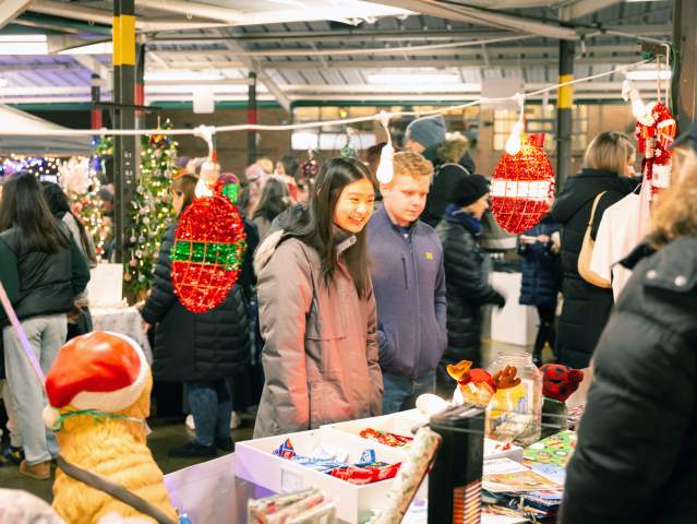 Couple shopping at Kindlefest holiday market