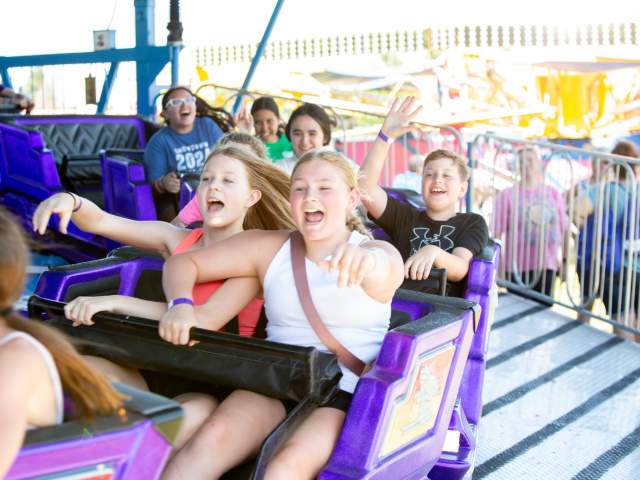 Kids on Carnival Ride at PrairieFest