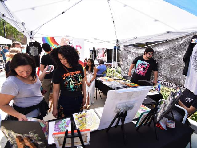 A group of shoppers and artisans at Alley Art Festival in Aurora, Illinois