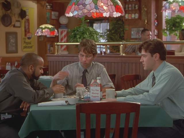 Office Space screengrab showing three men sitting around a table inside Chotchkies restaurant