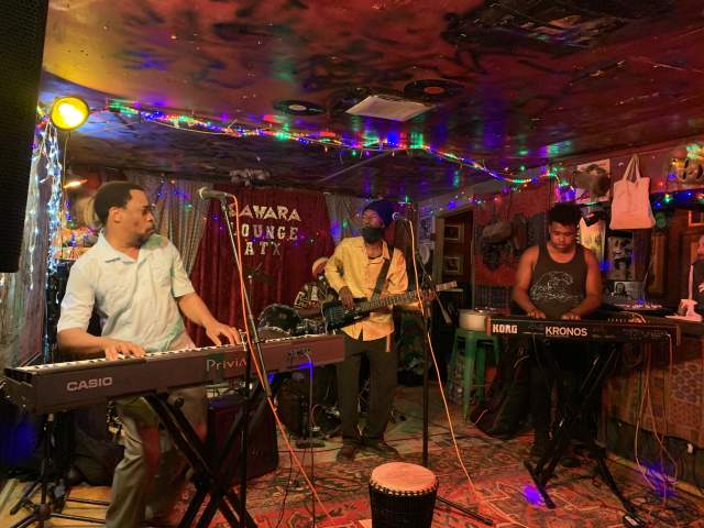 Three members of Crucial Prophet reggae band on stage at the Sahara Lounge