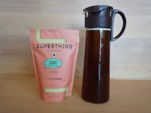 Bag of Superthing Coffee next to cold brew coffee from Patika in Austin Texas