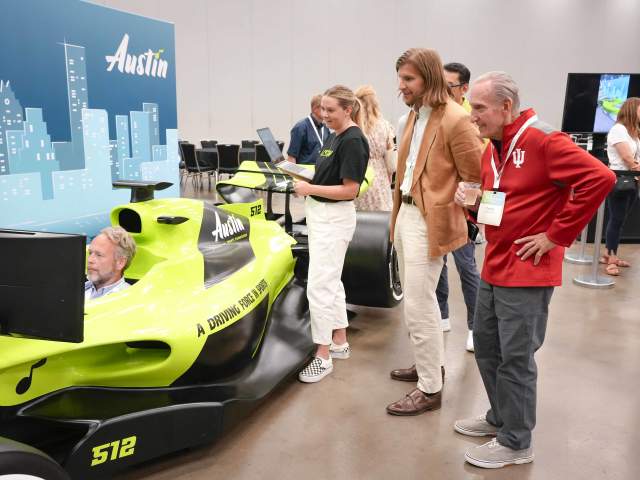 Image of the Austin Sports Commissions F1 Simulator in use at the ASCM Conference.