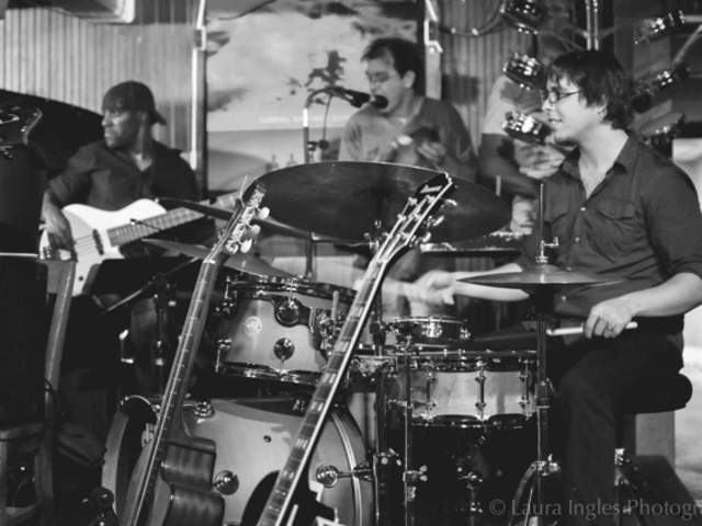 photo of a jazz band playing at the Elephant Room with drummer in foreground