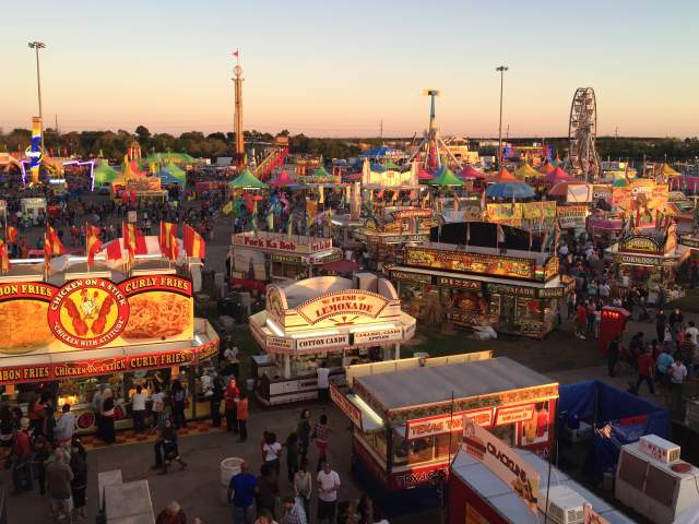Fair booths and people at the South Texas State Fair