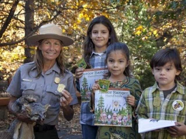 Ranger posing with junior rangers for the Big Thicket Junior Ranger Day