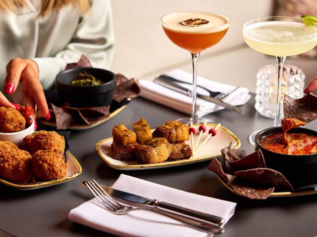 People enjoying small plates and cocktails at Rick's Bristol