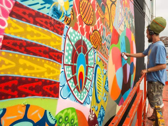 Louis Masai painting at Upfest 2016 in Bedminster, Bristol - Credit Plaster