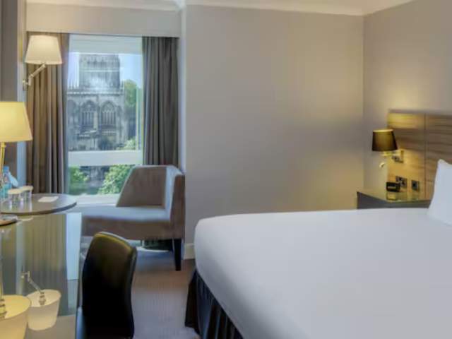 DoubleTree by Hilton City Centre bedroom with view of St Mary Redcliffe