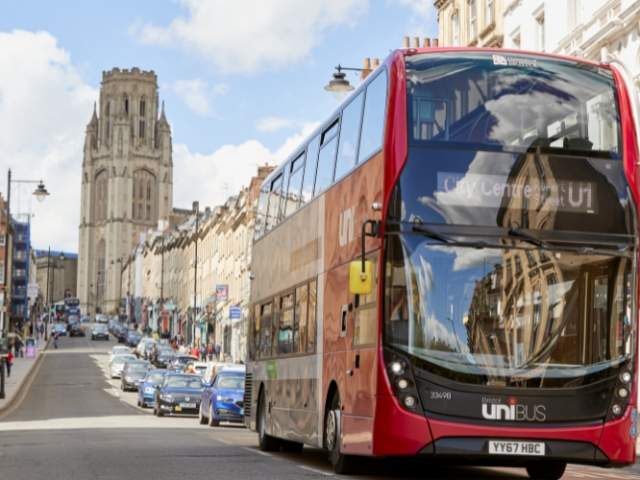 A red and black Bristol U1 Unibus driving along Park Street in central Bristol - First Bus