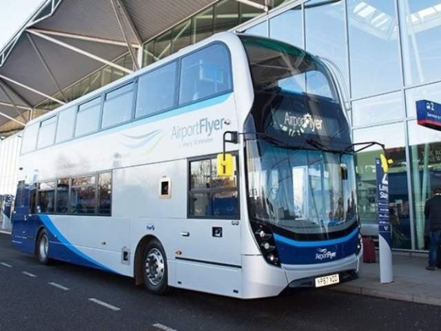A grey double decker bus outside Bristol Airport