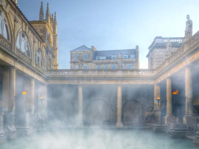 An wide shot of the Great Bath at The Roman Baths in central Bath, near Bristol