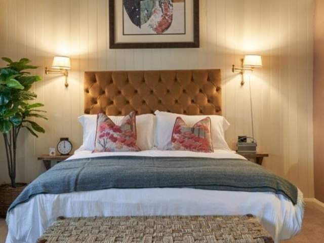 A large bed in a bedroom at The Langford - Credit The Langford
