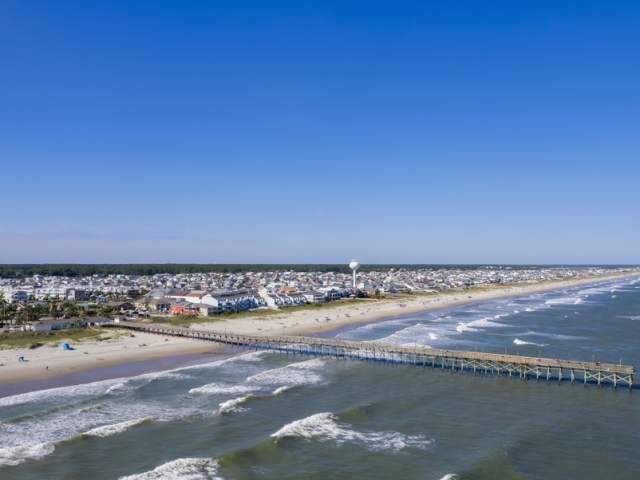 aerial view of a beach and pier