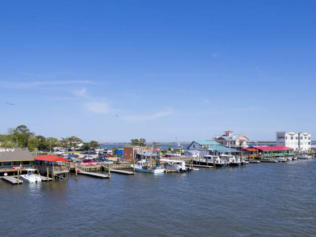 aerial view of a town with restaurants and boat slips